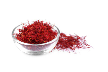 Dried saffron and glass bowl on white background