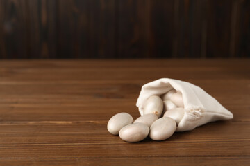 Raw jackfruit seeds on wooden table. Space for text