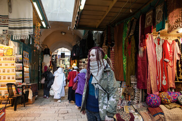 Fototapeta na wymiar Tourist young woman at Jerusalem's old city market, Israel