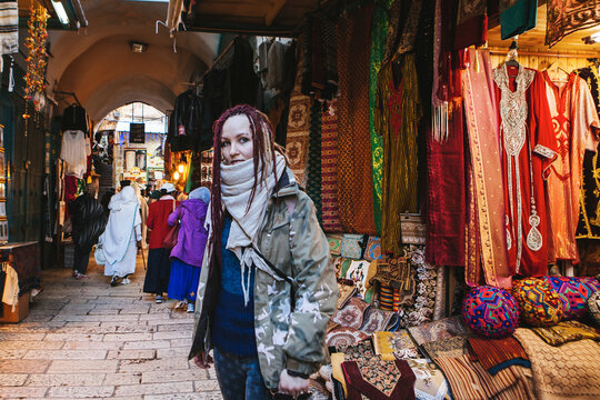 Tourist young woman at Jerusalem's old city market, Israel