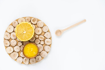 Fototapeta na wymiar honey and lemon on white - alternative medicine