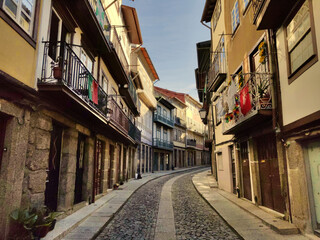 landscape of an empty street in Porto, Portugal, with old houses and buildings