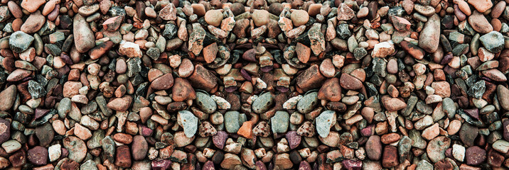 many small stones. multicolored pebbles. colored gravel