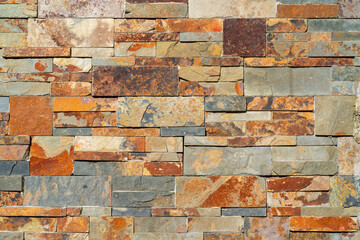 Decorative stone on the wall of a modern house. Architectural design.