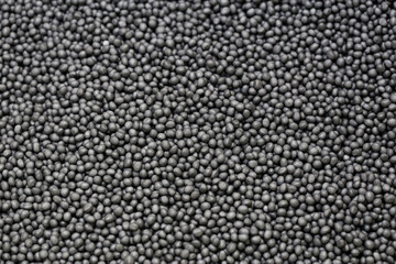 Macro image of graphite microbead pearls used for house insulation by injecting into the cavity...