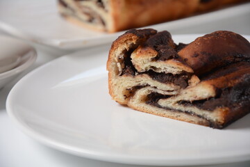 Babka or Brioche Bread. Stuffed with hazelnut cream. Traditional Jewish bread-like cake swirled with chocolate or cinnamon and topped with nuggets of cinnamon-sugar streusel.