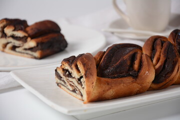 Babka or Brioche Bread. Stuffed with hazelnut cream. Traditional Jewish bread-like cake swirled with chocolate or cinnamon and topped with nuggets of cinnamon-sugar streusel.