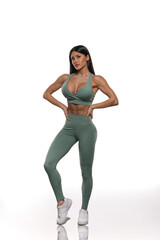 girl in olive leggings and top on a white background