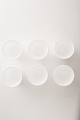 food delivery home delivery business concept. white disposable styrofoam cups on white background with copy space for text.  Flat lay. disposable tableware for outdoor recreation.