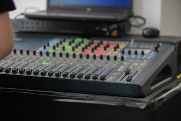 Closeup Analog sound mixer with selected focus. Professional audio mixing console broadcasting.
