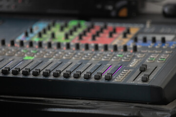 Closeup Analog sound mixer with selected focus. Professional audio mixing console broadcasting.