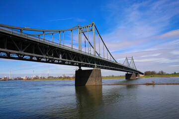 Krefeld (Ürdingen) - March 1. 2021:  View on old steel bridge over river rhine, industrial area background