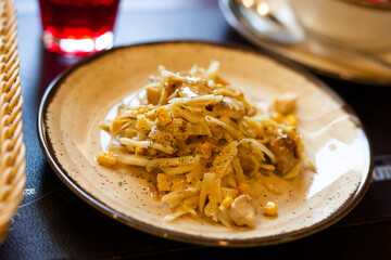 warm salad with chicken, cabbage and with corn and mustard sauce