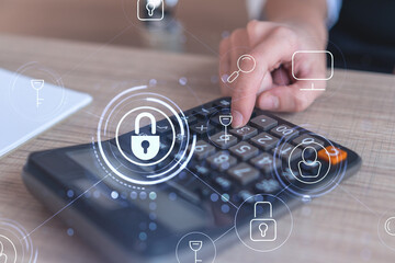 A businesswoman computing probability of risks in cyber security protection using calculator....