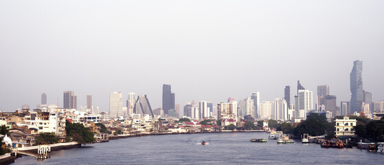 Fototapeta premium Bangkok, cityscape building with river and boat background. skyline