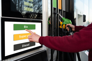 A man chooses biofuel at a self-service gas station
