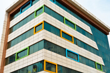 Modern glass building in the city center, business center with blue sky