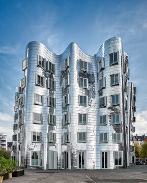 DUSSELDORF, GERMANY - APRIL 16: Modern buildings in Media harbor in Duesseldorf, Germany on APRIL 16, 2015. The Neuer Zollhof designed by Frank O. Gehry and completed in 1998.