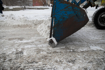 Snow plow and snow truck cleaning the streets during a snow storm in night maintenance action in Belgrade, Serbia
