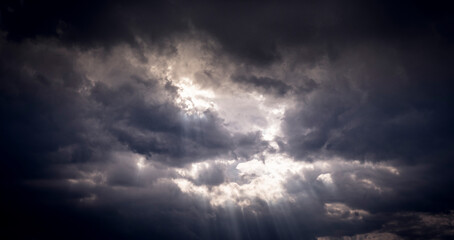 Naklejka na ściany i meble Dark rain clouds in the sky