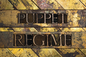 Puppet Regime text on vintage textured grunge copper and gold background