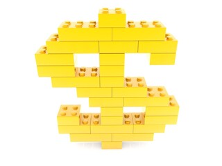 Dollar sign from gold toy bricks to white