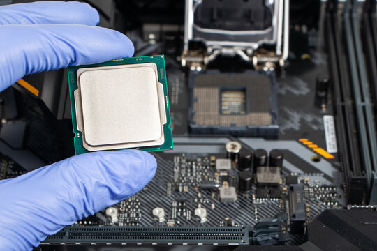 Plug in CPU microprocessor to motherboard socket. Technological background. Concept computers harware