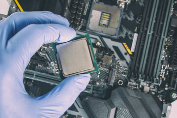 Plug in CPU microprocessor to motherboard socket. Technological background. Concept computers...