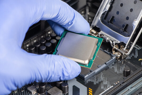 Plug in CPU microprocessor to motherboard socket. Technological background. Concept computers harware
