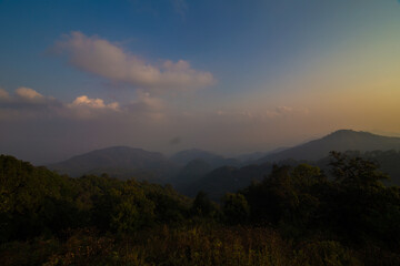 Aerial view mountain field sunrise morning with fog