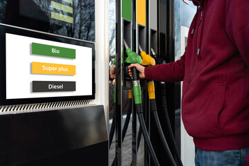 A man chooses biofuel at a self-service gas station
