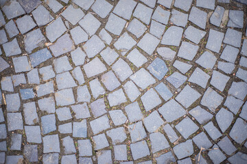 stone pavement texture, Old square stone tiles on the road and sidewalk, old style stone paving...