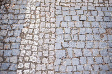 stone pavement texture, Old square stone tiles on the road and sidewalk, old style stone paving...