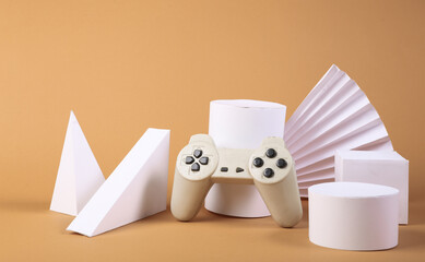 Retro joystick and geometric shapes on a beige background. Concept art. © splitov27