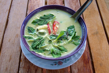 Thai Green Curry on wooden table, Gaeng Kiaw Wan