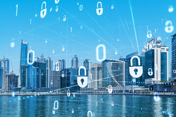 Skyscrapers of Dubai business downtown. International hub of trading and financial services. Lock icon hologram, concept of datum security. Double exposure. Dubai Canal waterfront.