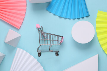 Shopping trolley on Abstract background with geometric shapes. Minimalism. Concept art. Creative layout