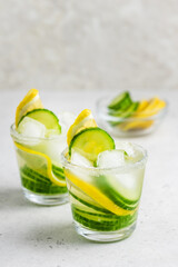 Infused water lemon cucumber summer drinks. Space for text.