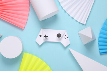 Origami gamepad on abstract background with geometric shapes. Minimalism. Concept art. Creative...
