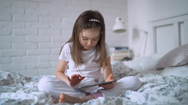 Girl using tablet at home