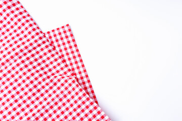 Red and white fabric scotch pattern on white background top view and with copy space.