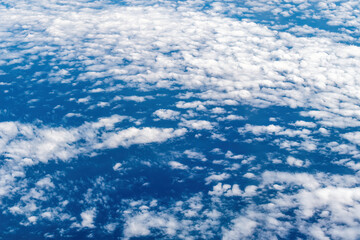 A beautiful cloud pattern is seen over the United States while flying on a commercial plane