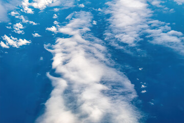 A beautiful cloud pattern is seen over the United States while flying on a commercial plane