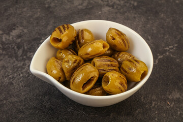 Green grilled olives in the bowl