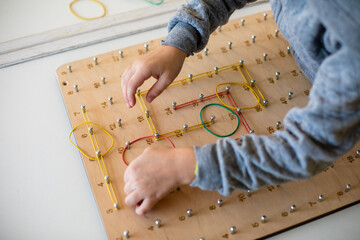 Exploring basic math and geometry concepts with geoboard