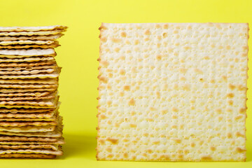 Pesach matzah on a yellow background. copy space.