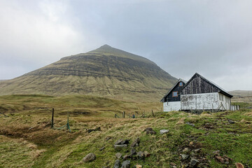 Fototapeta na wymiar faroe islands, autumn, cliff view, landscape, mountain, nature, sky, mountains, grass, house, green, summer, hill, clouds, meadow, field, travel, cloud, blue, old, forest, rural, norway, iceland, cabi
