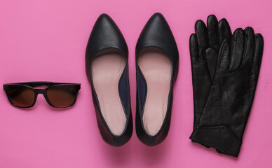 Stylish women's accessories and shoes on pink  background. Leather high heel shoes, gloves, sunglassess. Top view, Flat lay