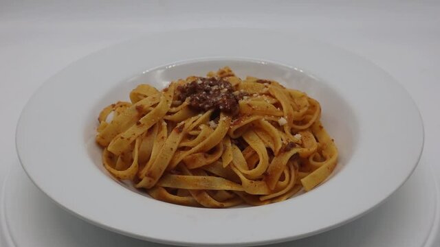 Fresh italian Tagliatelle with rag&ugrave; alla bolognese and Parmigiano Reggiano cheese. 
