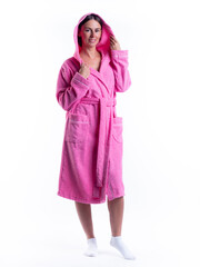 woman in a Bathrobe on an isolated white background with a smile on her face.